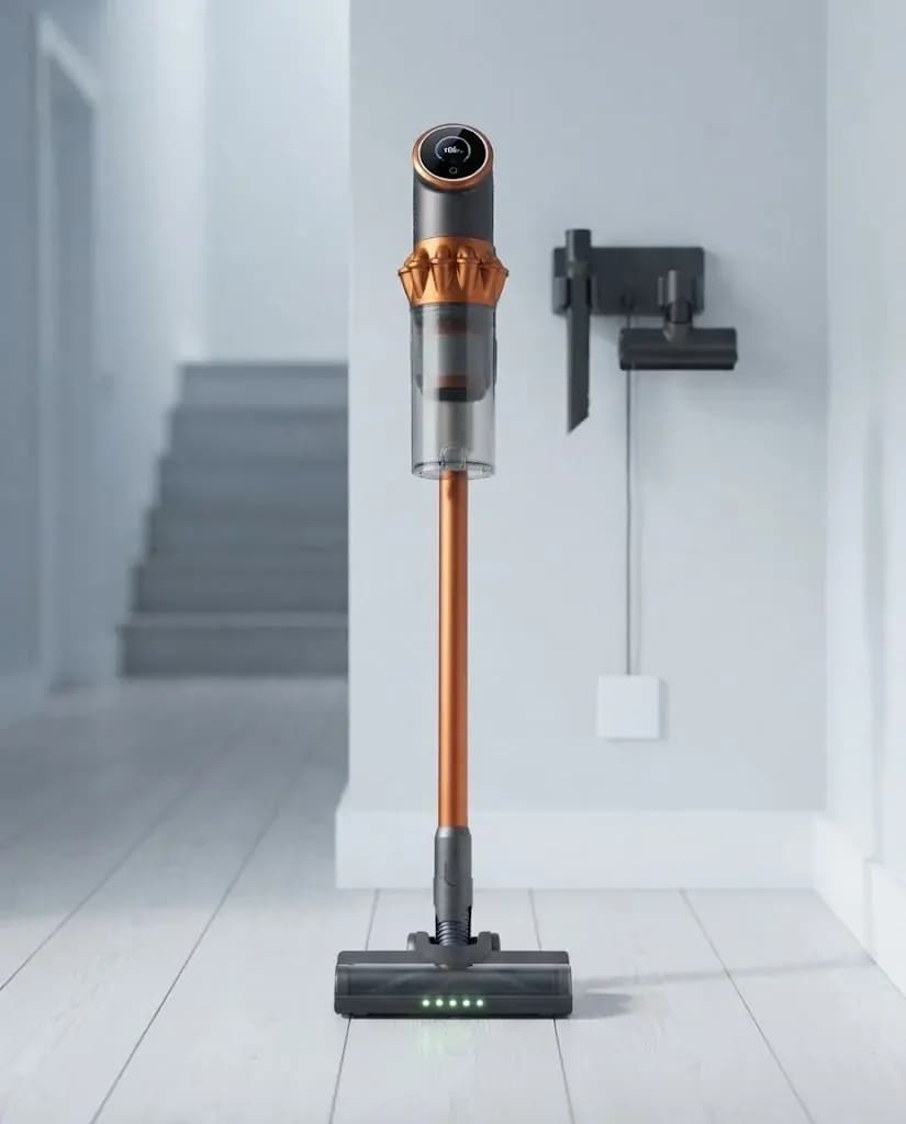 Vekto Vacuum V18 standing upright on its own in a bright hallway beside its wall dock