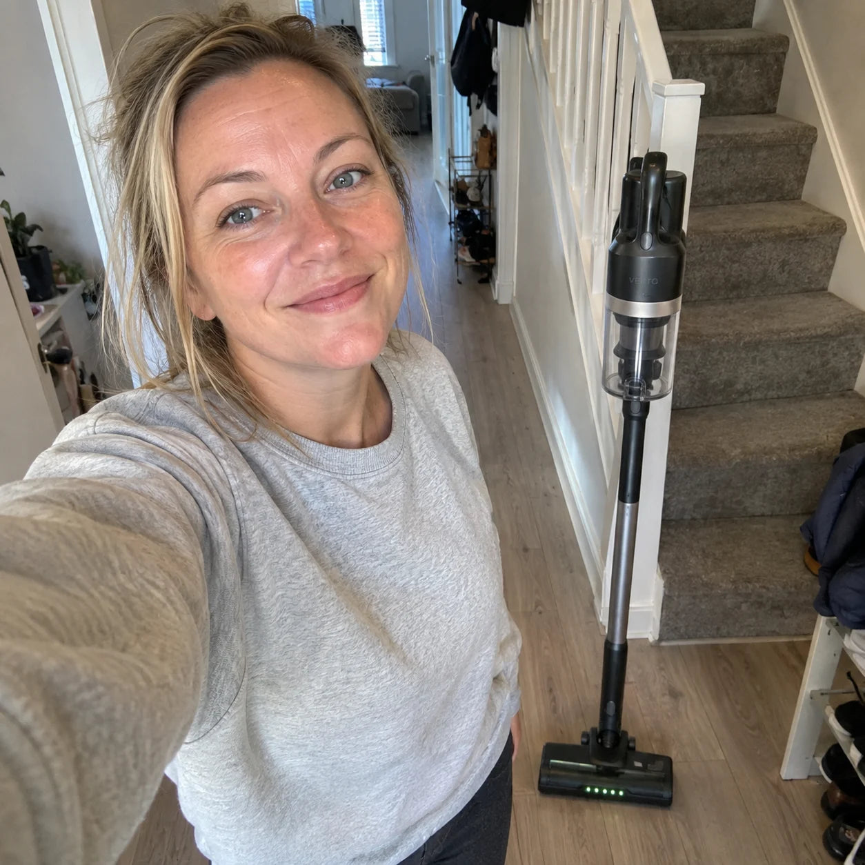 Emma in her hallway with the Vekto Stick standing beside her